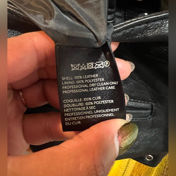 Genuine leather black mini shorts lined with silver metal grommets. Size 8 - Picture 7 of 7